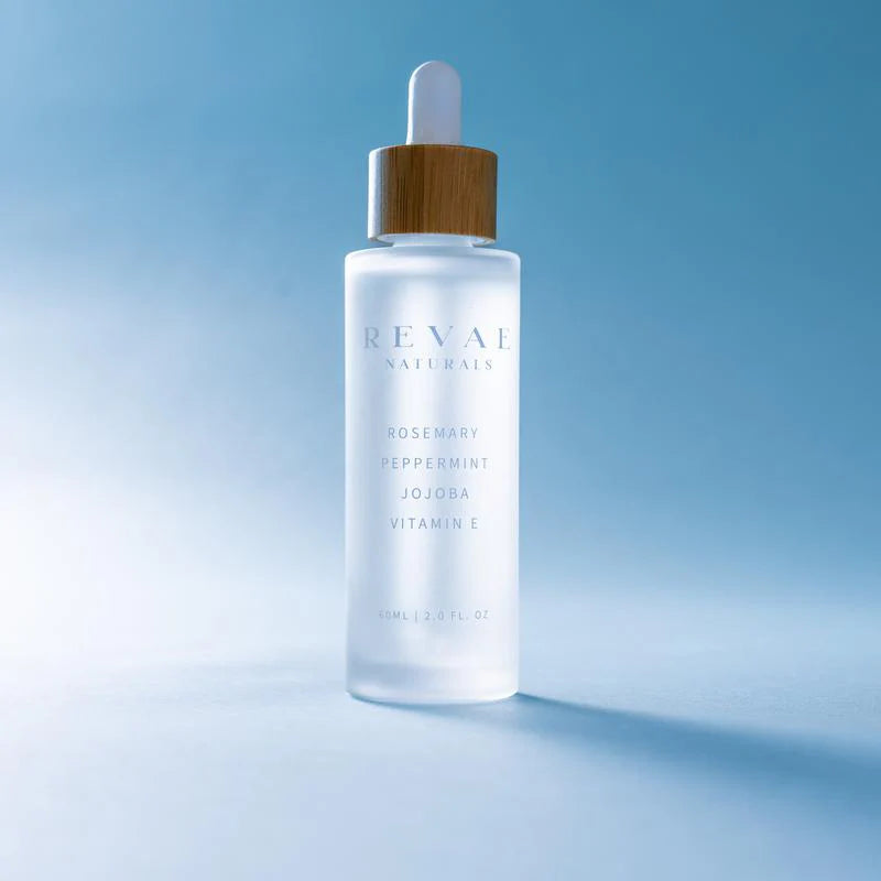 Natural Hair Growth Serum bottle with jojoba and rosemary for effective hair loss treatment.