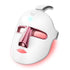 Light therapy face mask with pink accents and LED light display designed for skincare and relaxation.