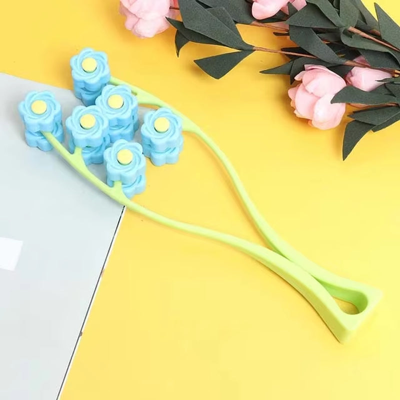 Jade gua sha scraping tools with flower-shaped rollers on a pastel background for facial massage and skincare.
