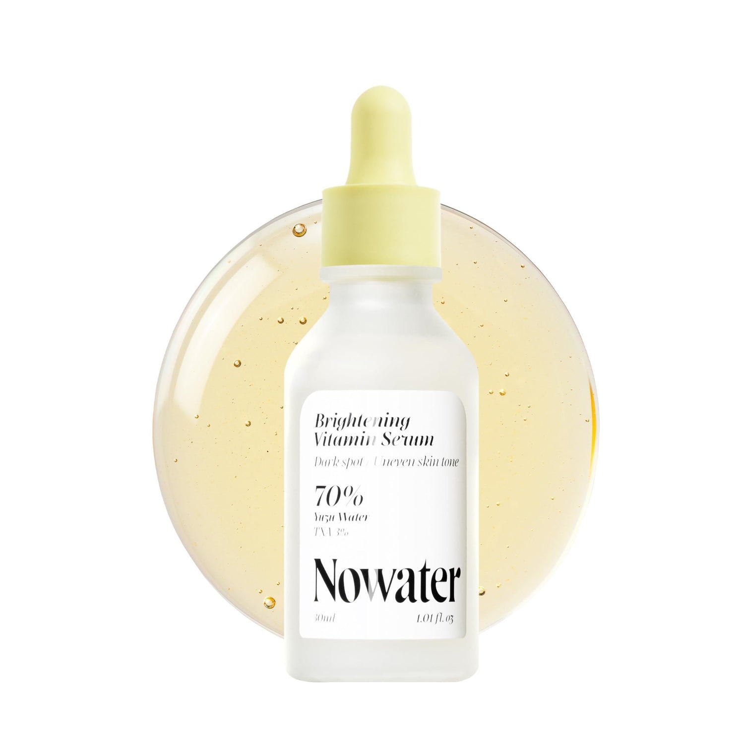 TXA vitamin serum for dark spots in a dropper bottle with brightening formula, designed to improve uneven skin tone.