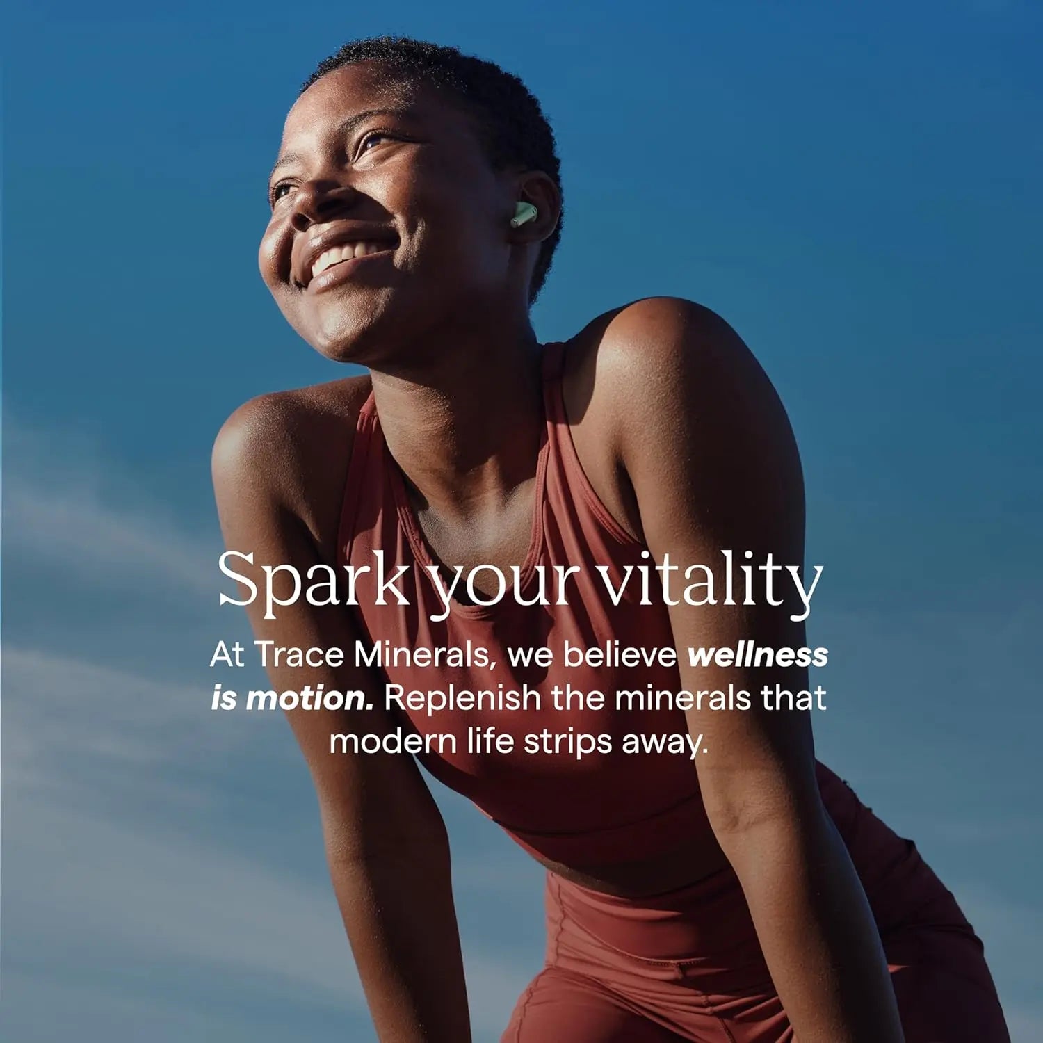 Happy person enjoying vitality outdoors, promoting trace mineral drops for hydration.